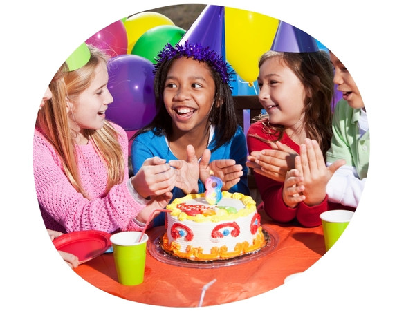 three girls celebrate an 8th birthday with rainbow cake
